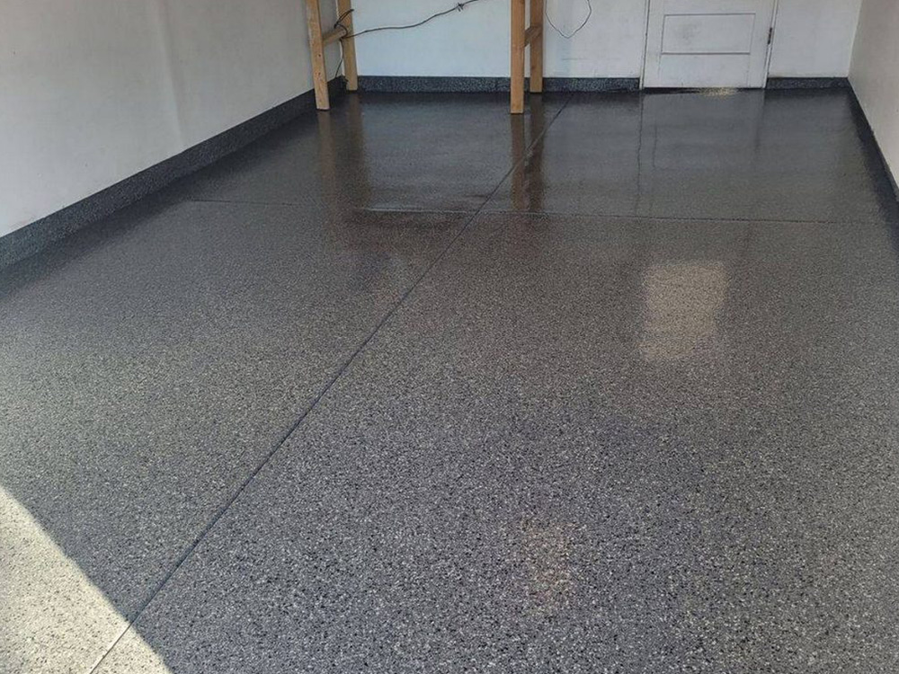 Affordable commercial epoxy flooring by NuWave Garages in Arvada, CO.