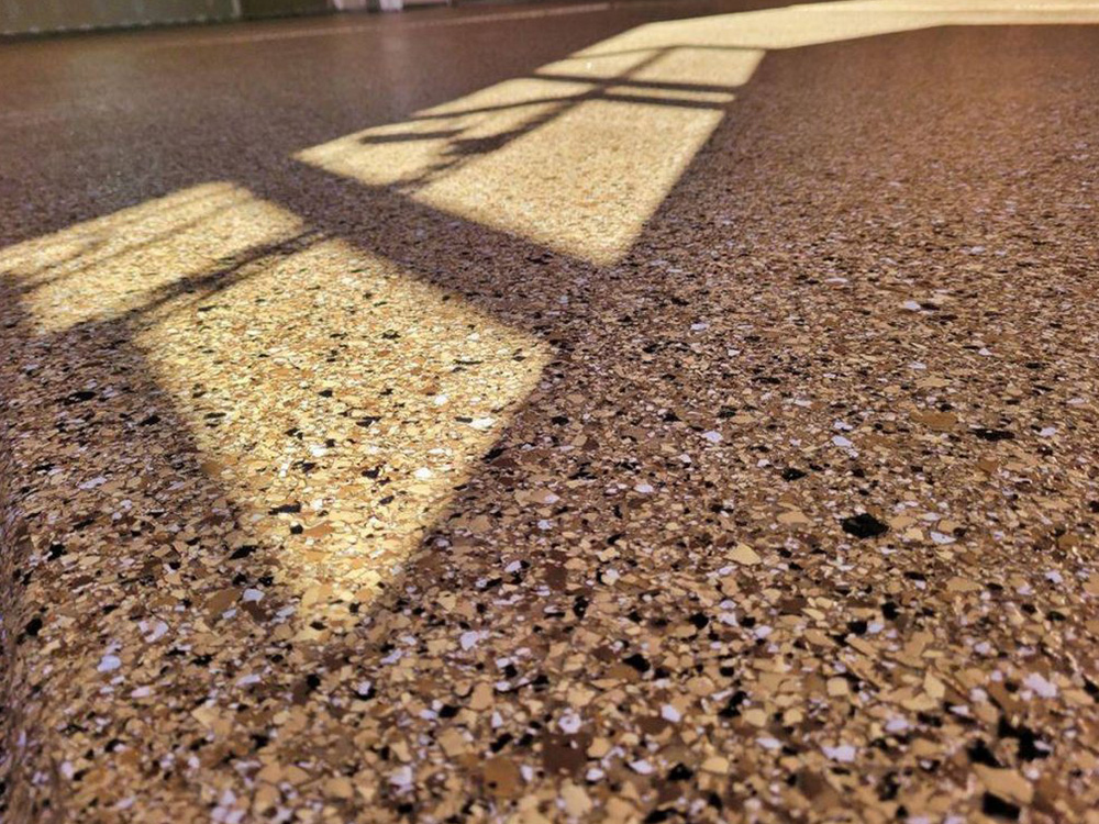Quality Longmont garage epoxy floor covering by NuWave Garages.