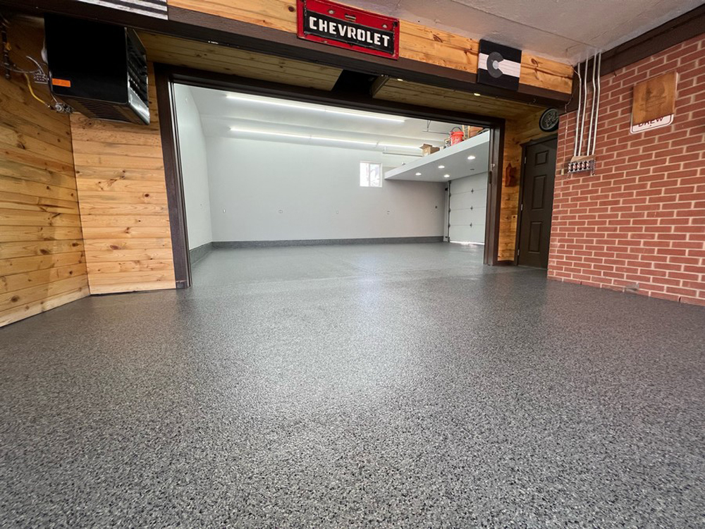 Quality epoxy garage flooring in Berthoud, CO by NuWave Garages.